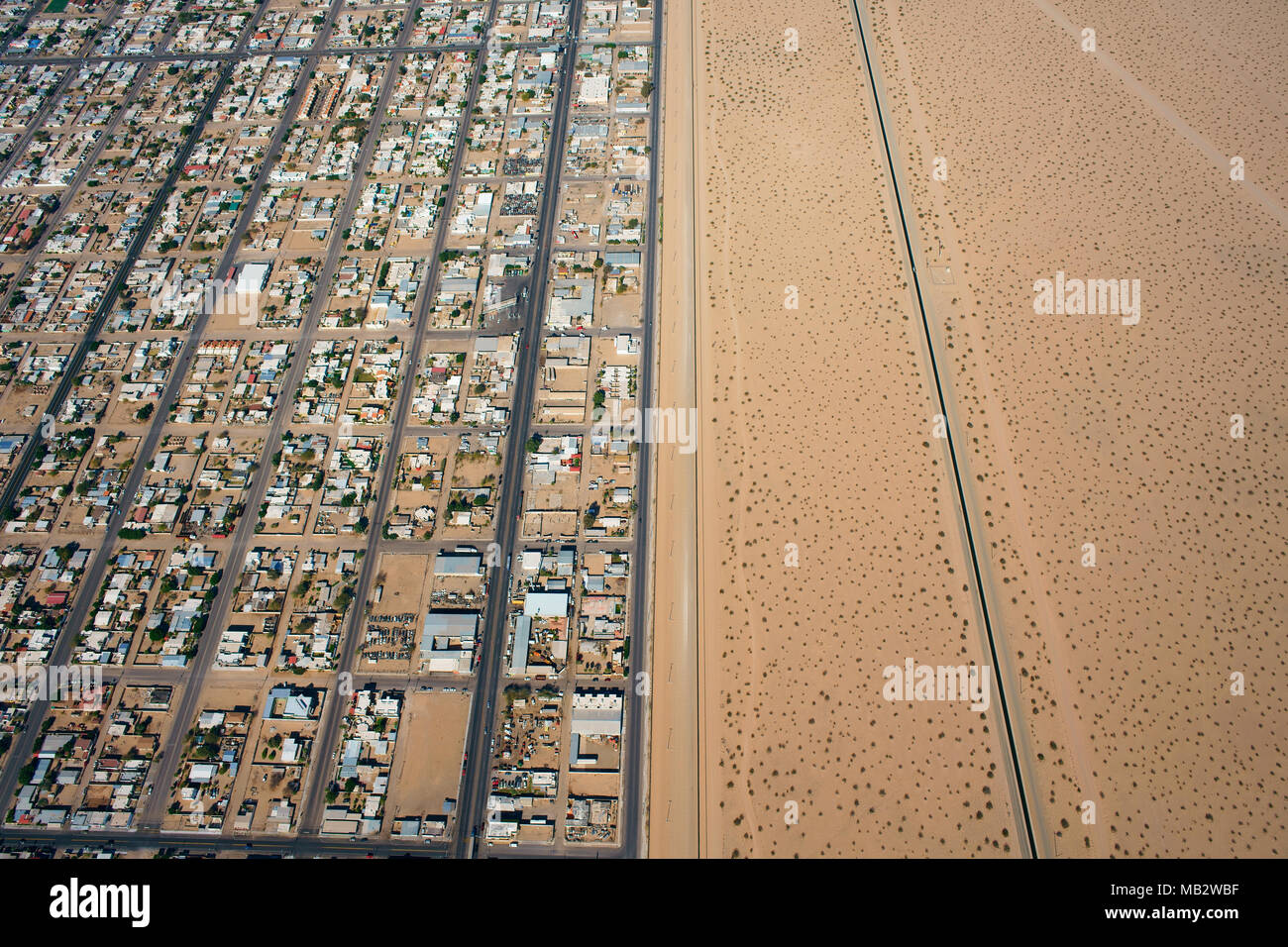AERIAL VIEW. International border between Mexico and the United States. City of San Luis Rio Colorado in Sonora, stretching alongside the U.S. Border. Stock Photo