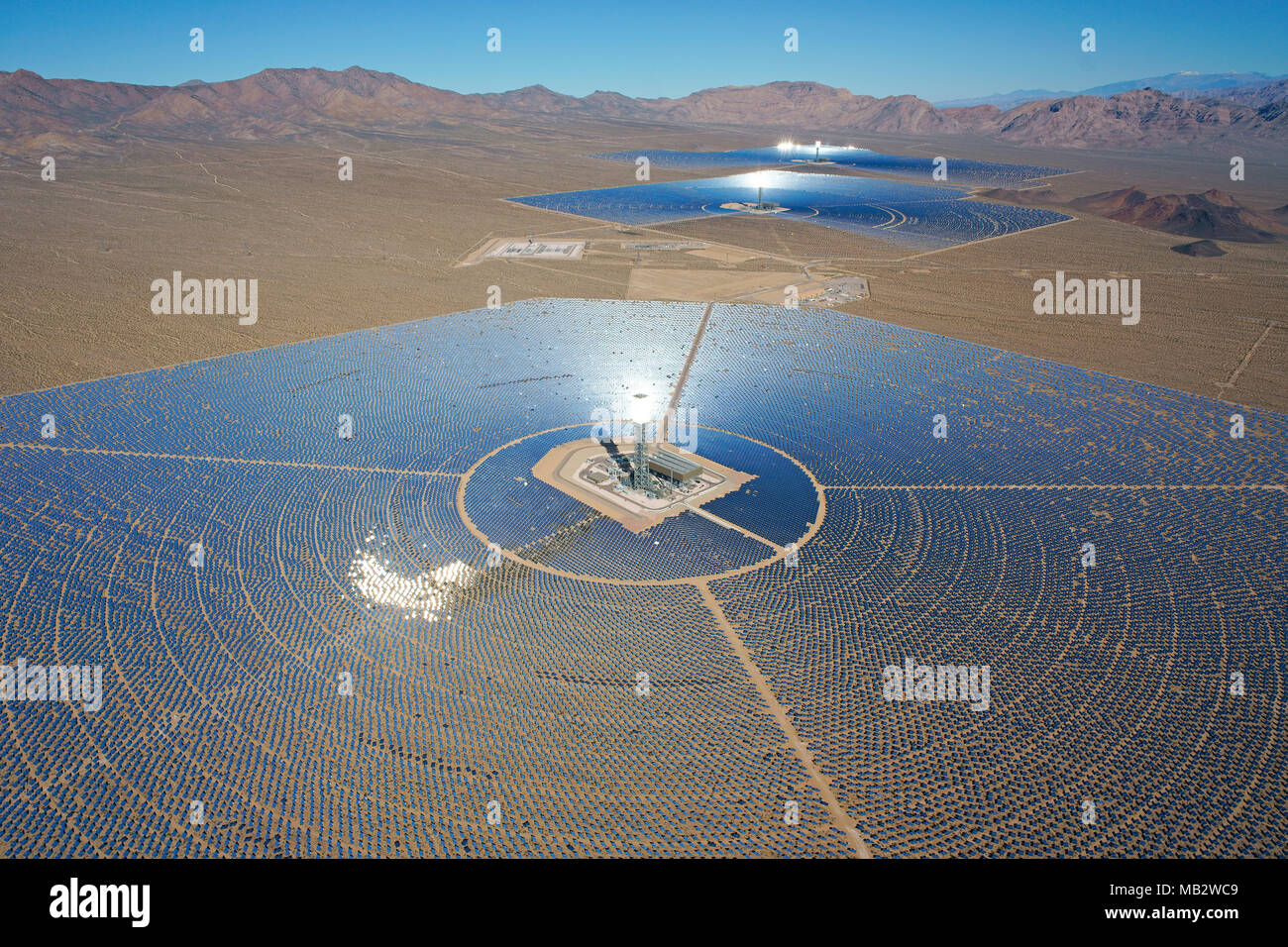 AERIAL VIEW. Ivanpah Solar Electric Generating System (world's largest concentrated solar power plant as of 2018). Mojave Desert, California, USA. Stock Photo