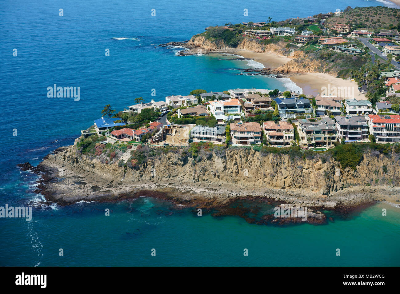 AERIAL VIEW. Luxurious properties on a picturesque rocky promontory. Emerald Point, Laguna Beach, Orange County, California, USA. Stock Photo
