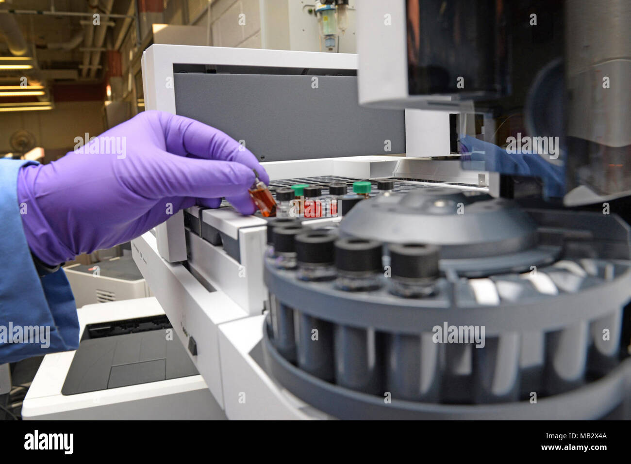Lab Fuelchemist Robert Bills, Aerospace Fuels Lab chemist, places a sample of hydraulic ...