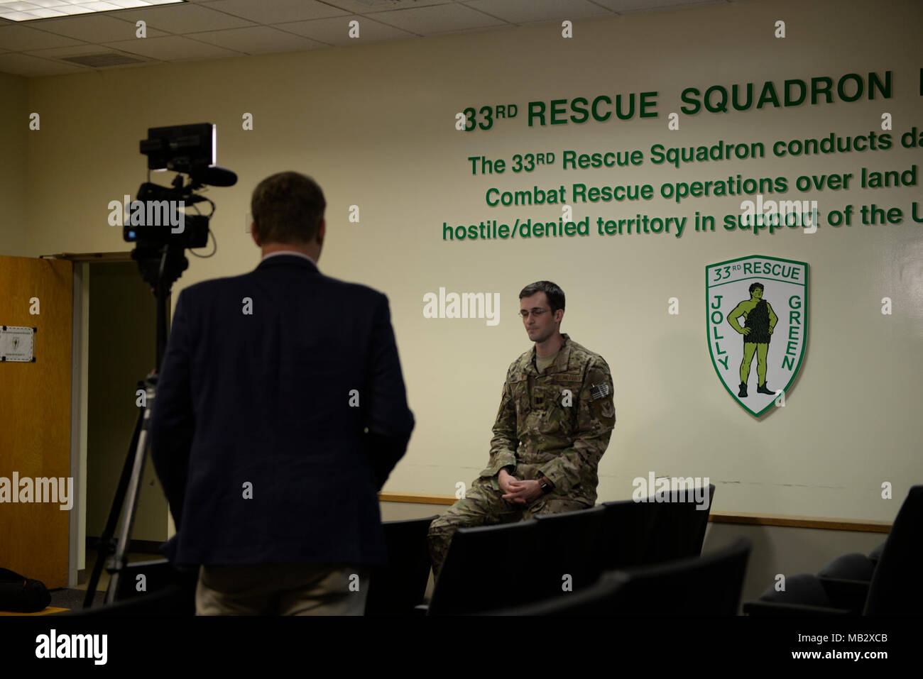 U.S. Air Force Capt. Chris Allen, 33rd Rescue Squadron flight commander, is interviewed by Jeff Martin, Defense News reporter, Feb.13, 2018, at Kadena Air Base, Japan. Media Organizations were invited to tour the various squadrons that comprise the 18th Wing. Stock Photo