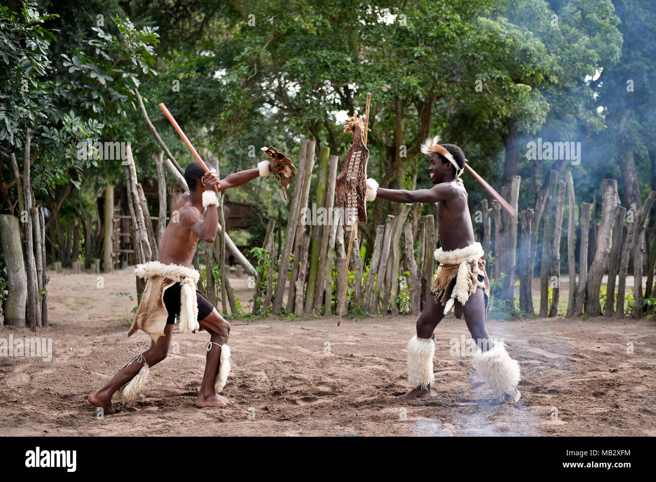 St. Lucia- South Africa - June 25, 2017: Zulu warrior in traditional dress with ighting spear in Khula Zulu Village in South Africa Stock Photo