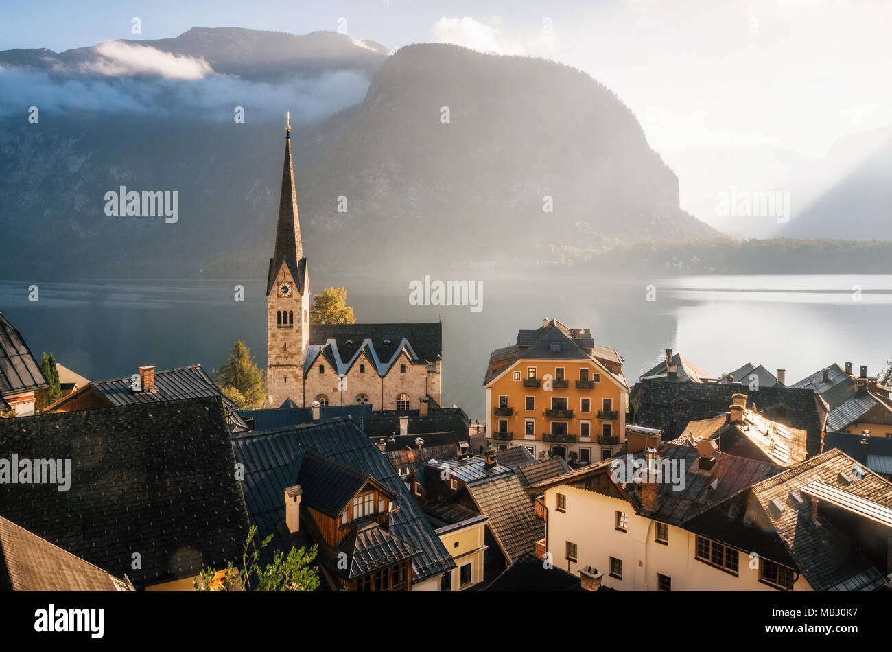 Scenic view of famous Hallstatt town on Hallstattersee lake in the Austrian Alps in morning light with bright clouds, Salzkammergut region, Austria Stock Photo