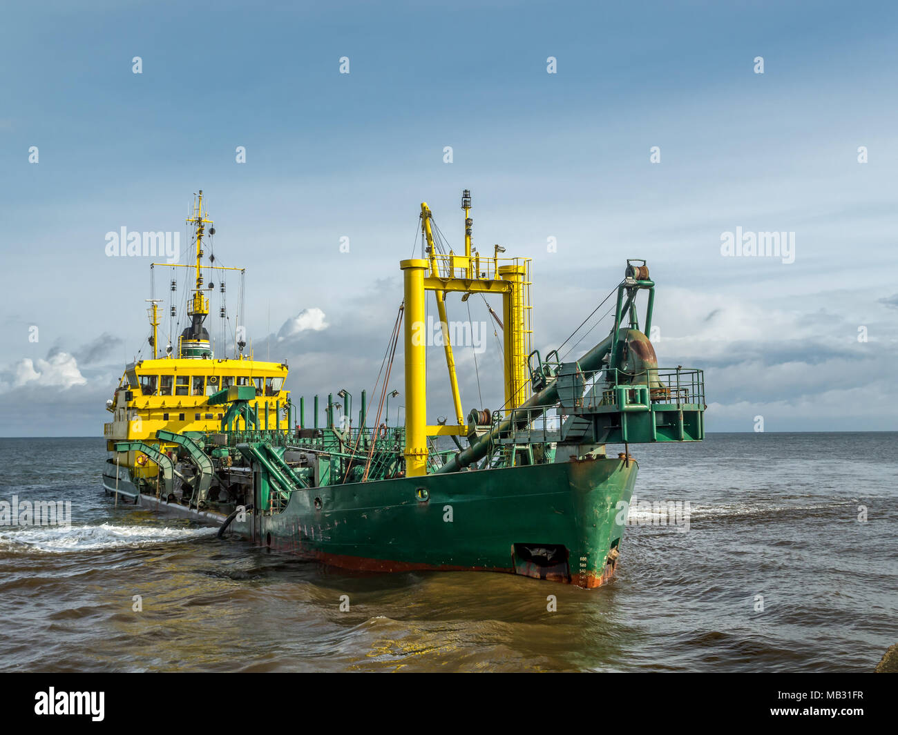 Hopper dredger vessel working in the bay Stock Photo Alamy