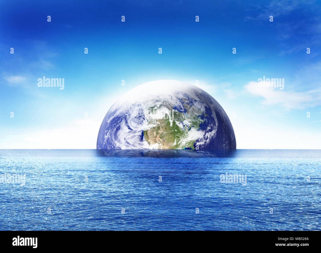 Birth of the world or doomsday scene, sinking earth globe or planet earth. Blue sea and beautiful world globe rising. Stock Photo