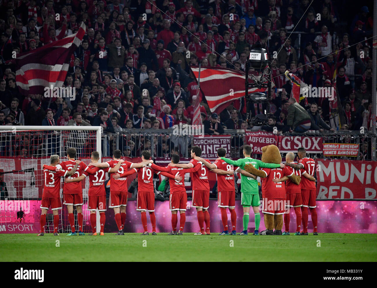 Bayern players let fans celebrate their victory in front of the south bend, Allianz Arena, Munich, Bavaria, Germany Stock Photo