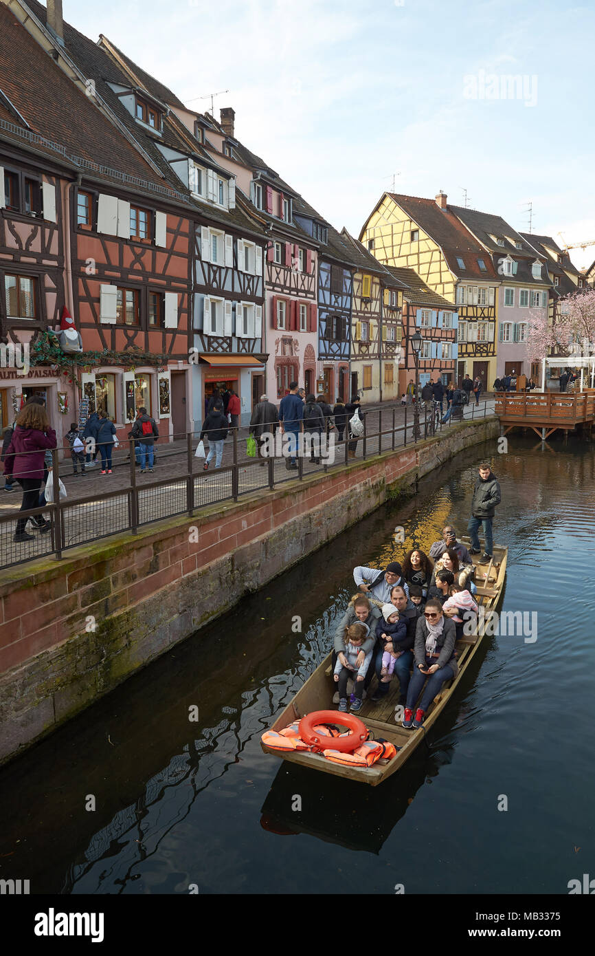 Tourist boat and half-timbered houses on the canal in the Old Town, Petite Venise, Colmar, Alsace, France Stock Photo