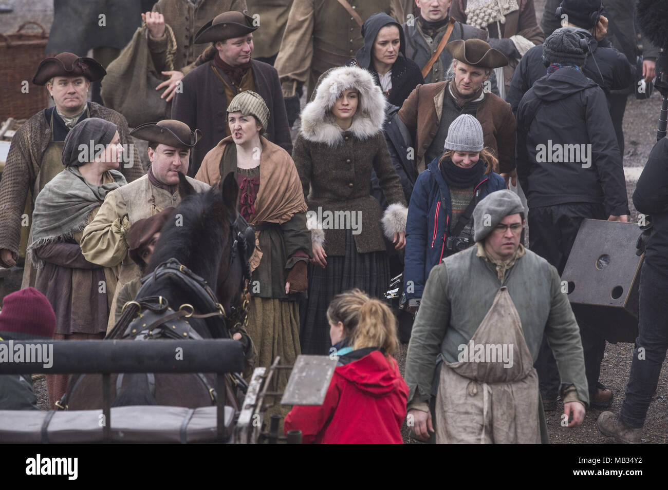 Outlander film crew and actors are spotted filming at a harbour in