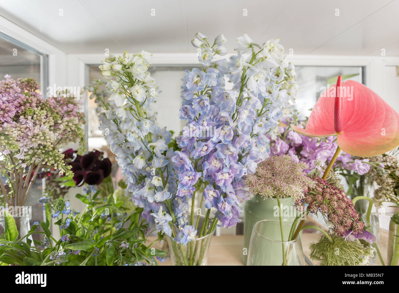 Flower shop concept. Different varieties fresh spring flowers in