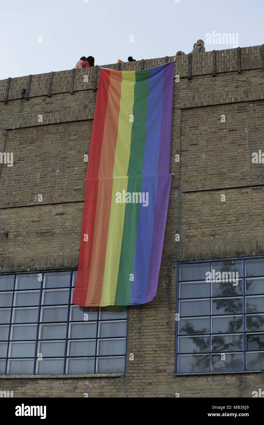 a 10 meter long rainbow flag hangs at a building during the Alkmaar pride  Stock Photo - Alamy