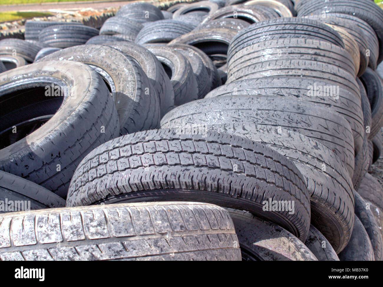 wall of worn out car tyres waiting for disposal to a recycling centre Stock Photo Alamy