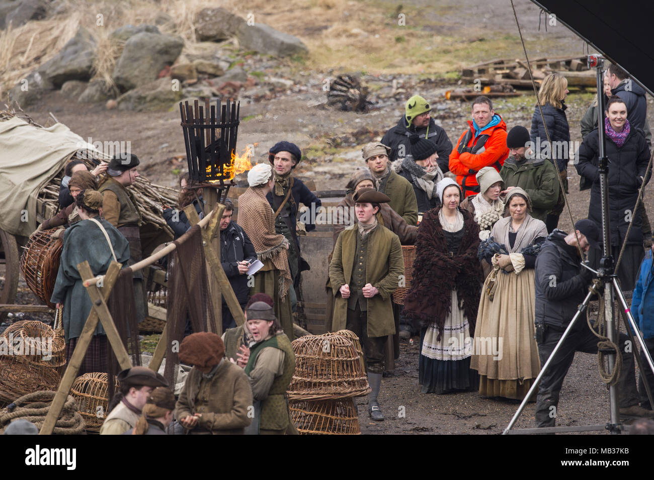 Outlander film crew and actors are spotted filming at a harbour in