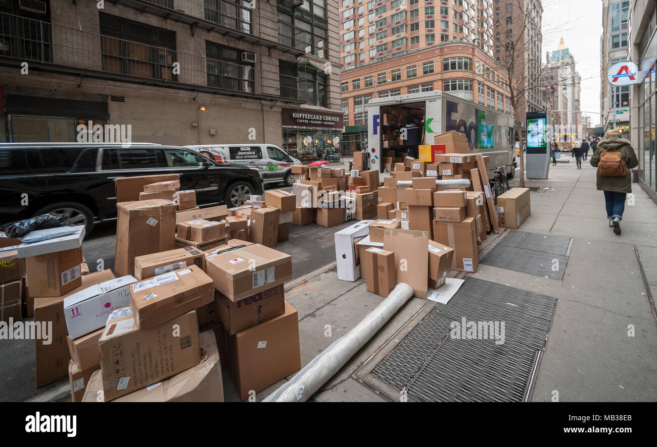FedEx workers sort packages for delivery in the Chelsea neighborhood of New York on Wednesday, March 28, 2018. (Â© Richard B. Levine) Stock Photo
