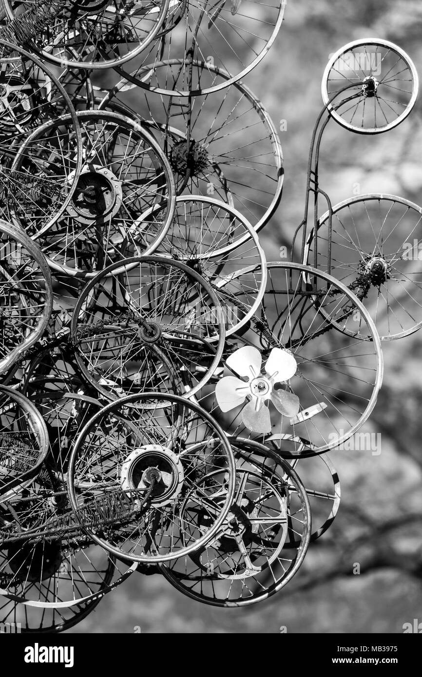 Partial black and white image of rusty old vintage wheels street art Stock Photo