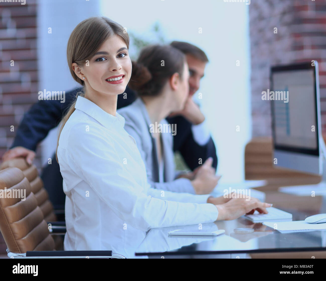 employees working on personal computers with financial data Stock Photo ...