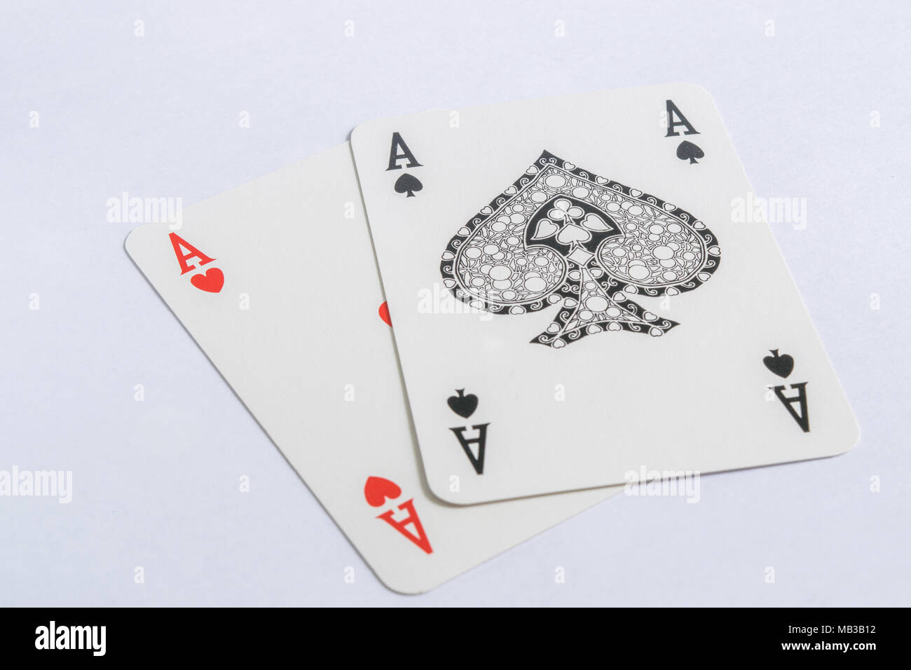 Hearts and spades aces of cards on white background Stock Photo Alamy