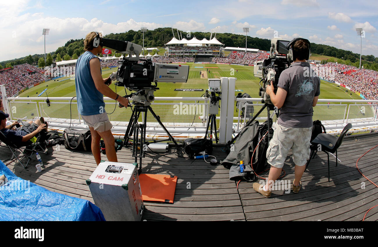 Outside broadcast TV camera operators working at a cricket match at the Rose Bowl on a summers day in 2008. Stock Photo