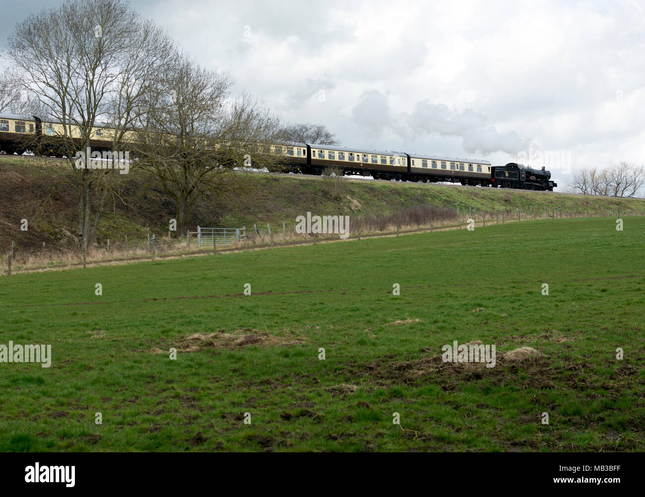 Steam train on the Gloucestershire and Warwickshire Steam Railway near Stanway, Gloucestershire, England, UK Stock Photo