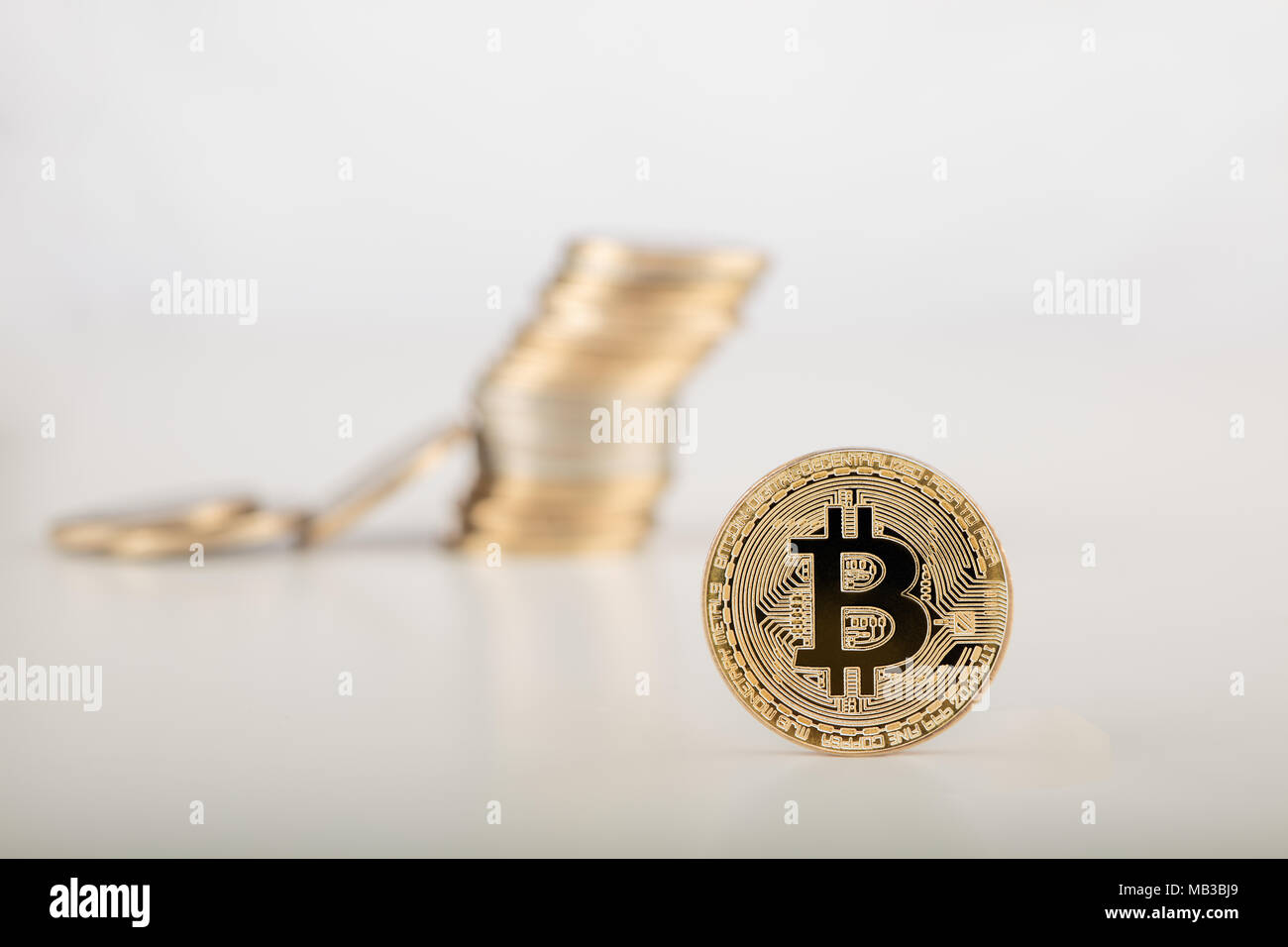 Golden bitcoin with money bitcoins background. Bit coin cryptocurrency banking money transfer business technology Stock Photo