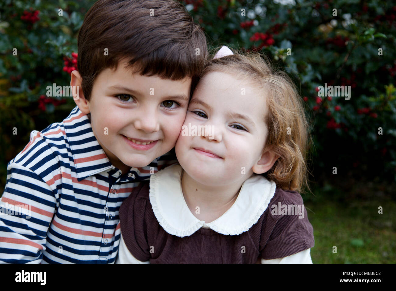 Head and Shoulders Portrait of Smiling Boy and Girl Stock Photo