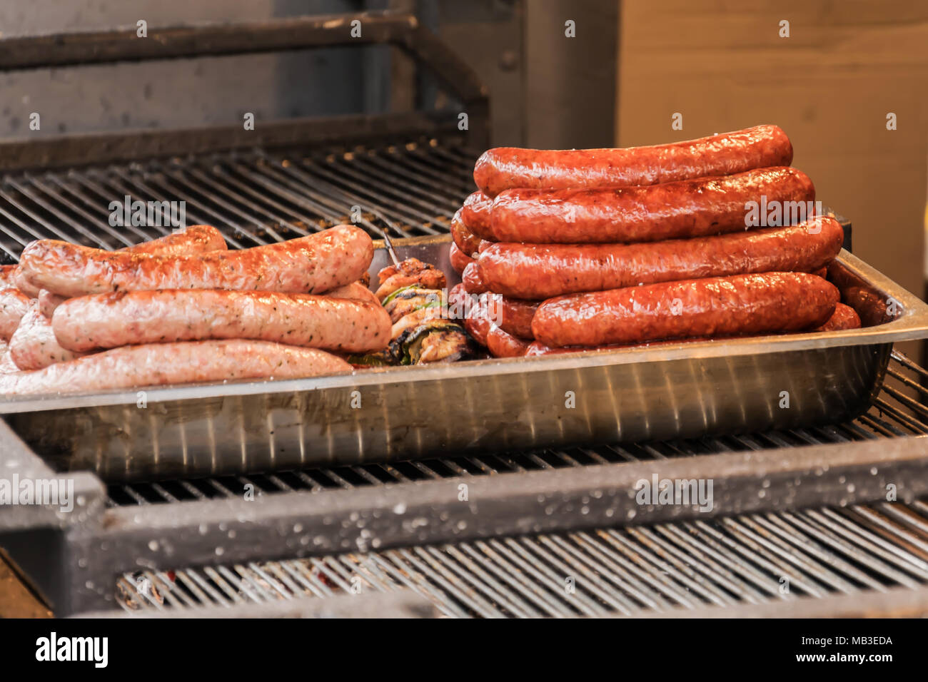 Sausages and kebabs on the grill. Baked and ready to eat. Stock Photo