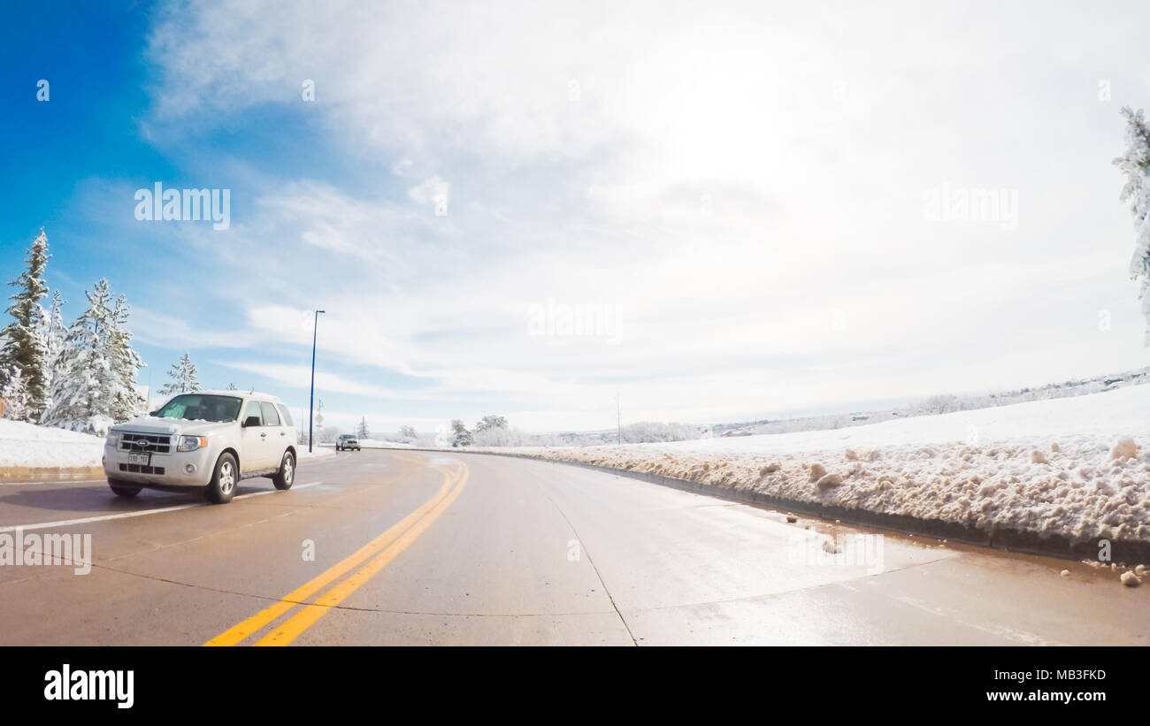 Driving on suburban road after the Sping snow storm Stock Photo - Alamy