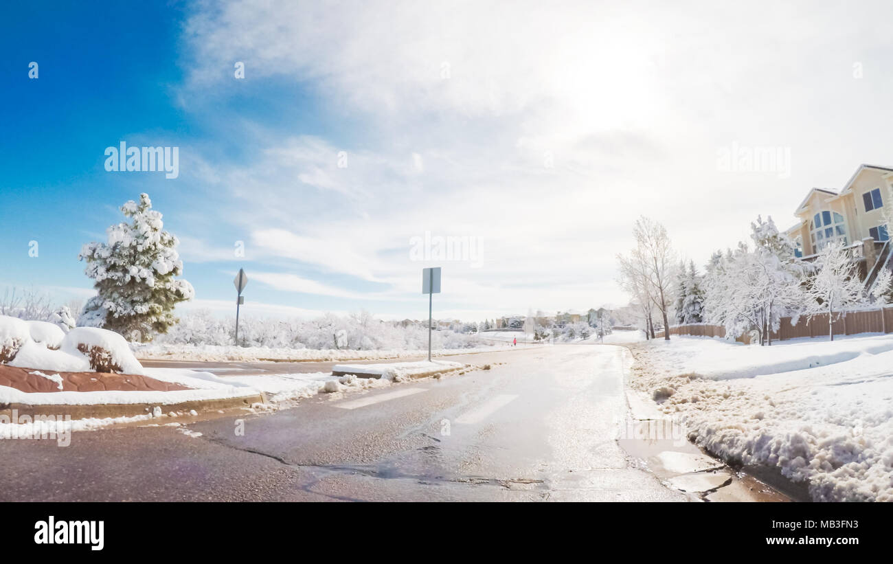 Driving on suburban road after the Sping snow storm Stock Photo - Alamy