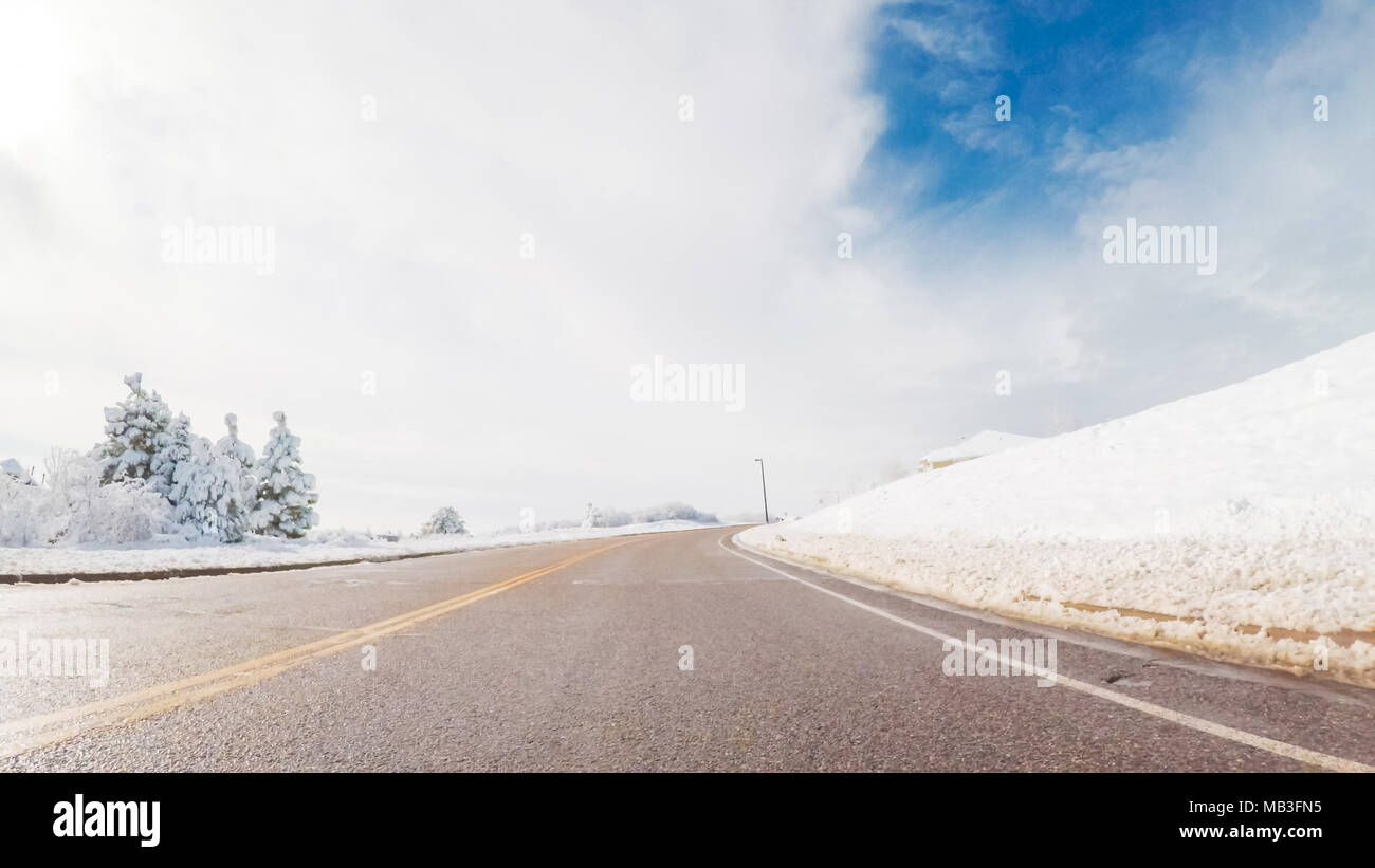 Driving on suburban road after the Sping snow storm Stock Photo - Alamy