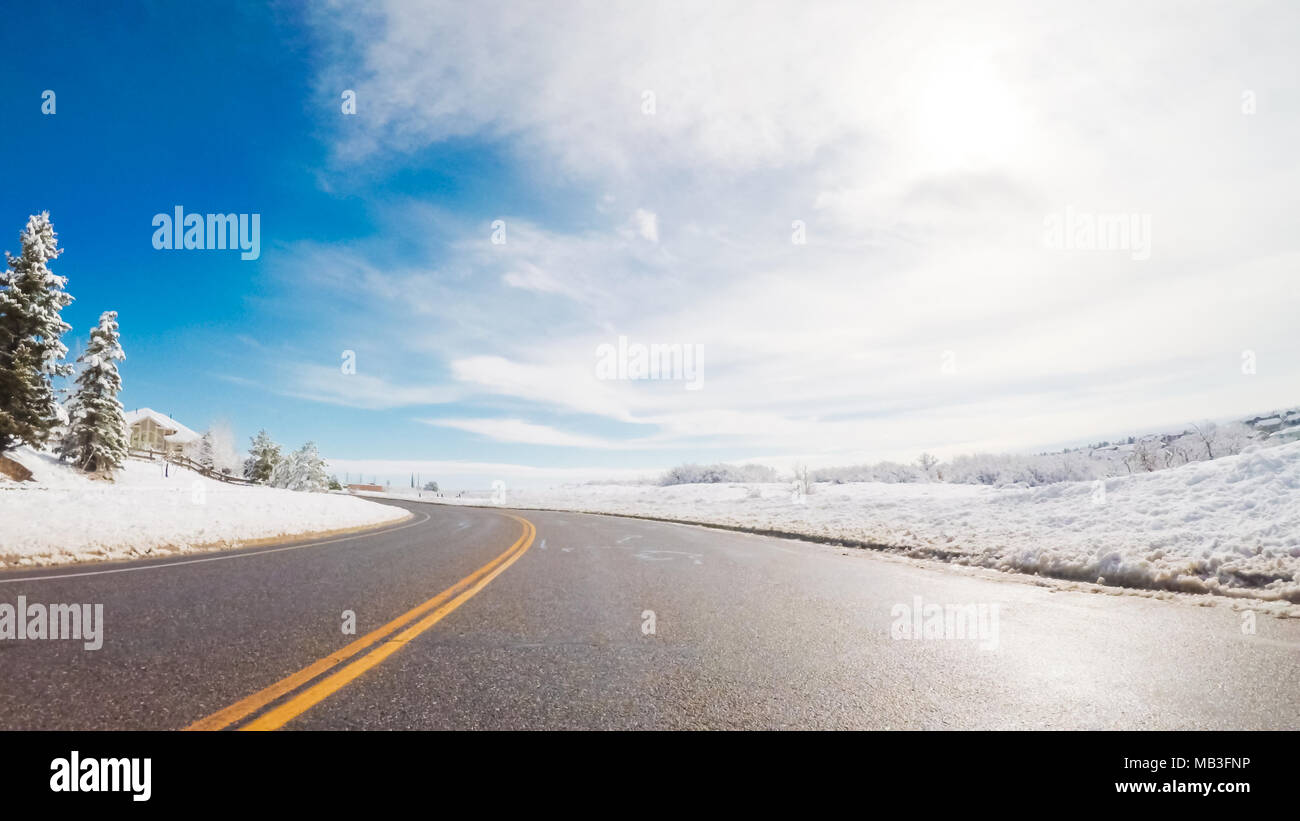 Driving on suburban road after the Sping snow storm Stock Photo - Alamy