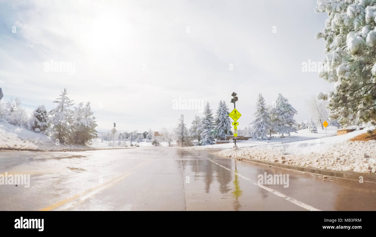 Driving on suburban road after the Sping snow storm Stock Photo - Alamy
