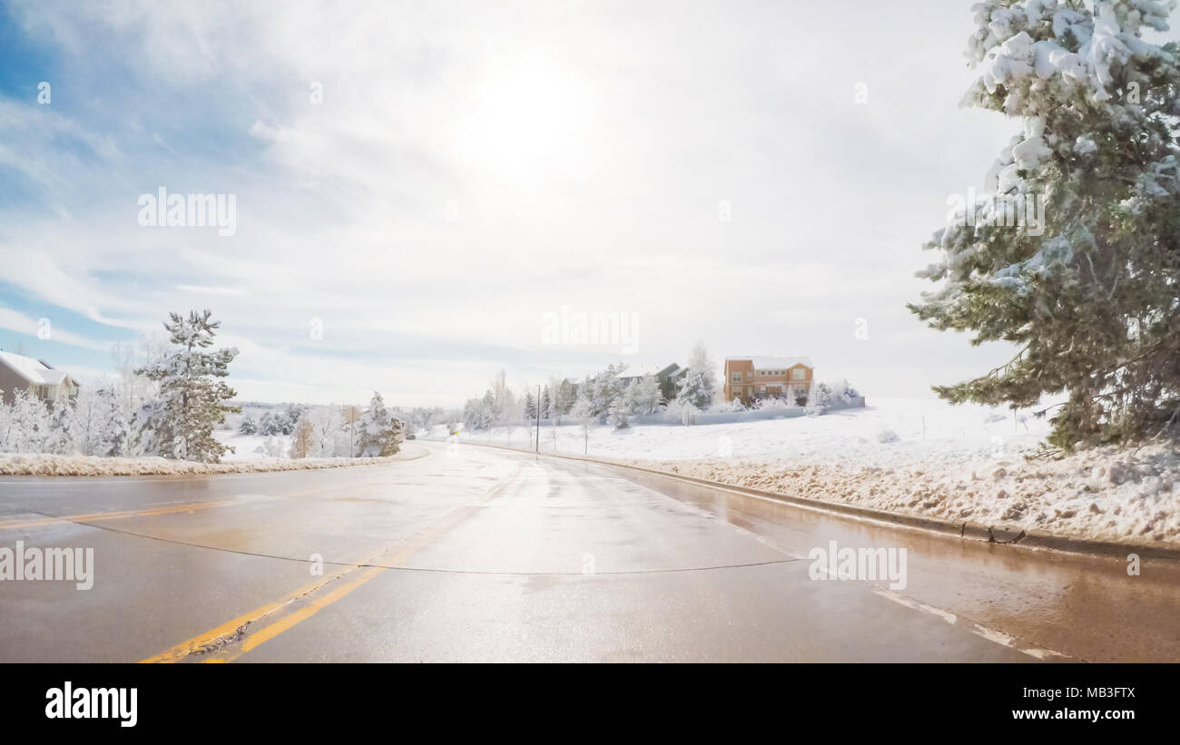 Driving on suburban road after the Sping snow storm Stock Photo - Alamy