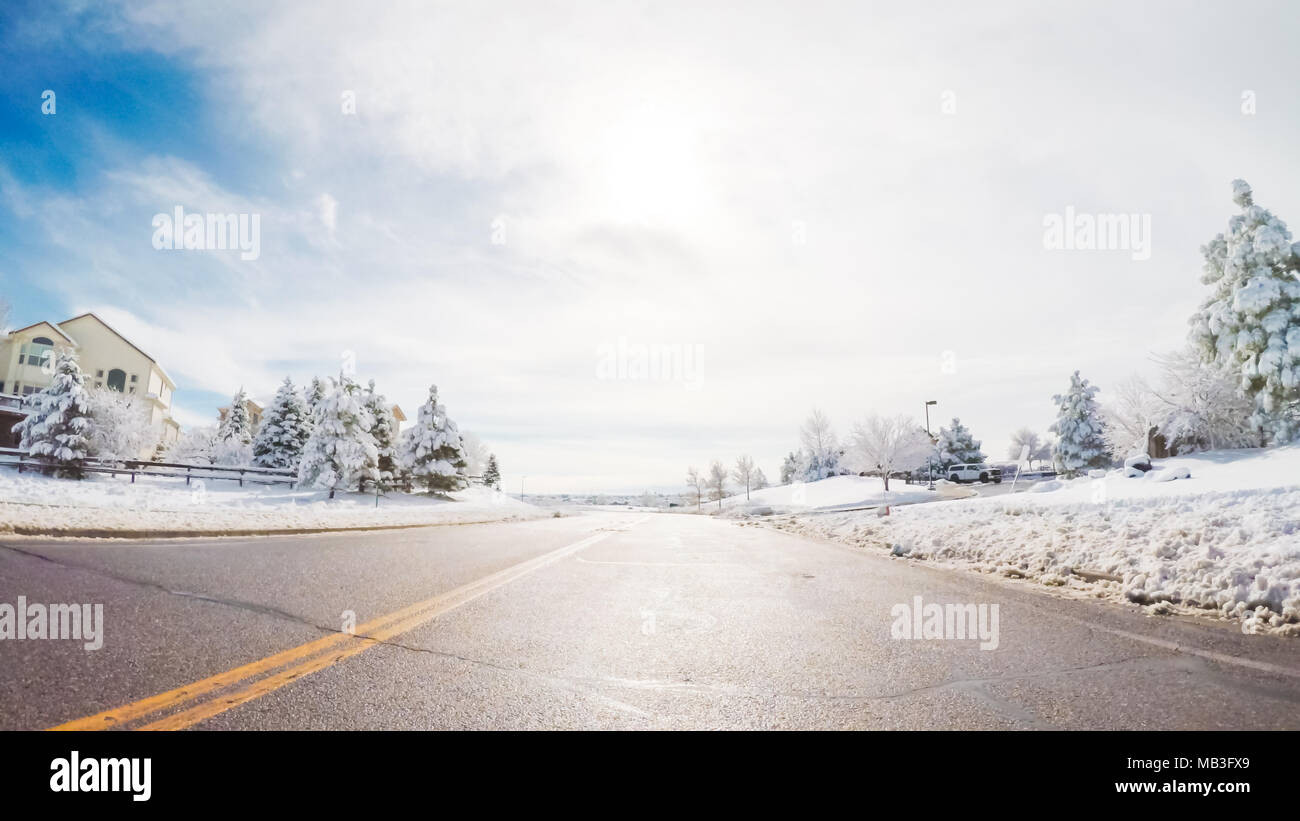 Driving on suburban road after the Sping snow storm Stock Photo - Alamy