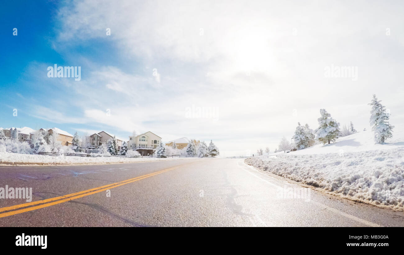 Driving on suburban road after the Sping snow storm Stock Photo - Alamy