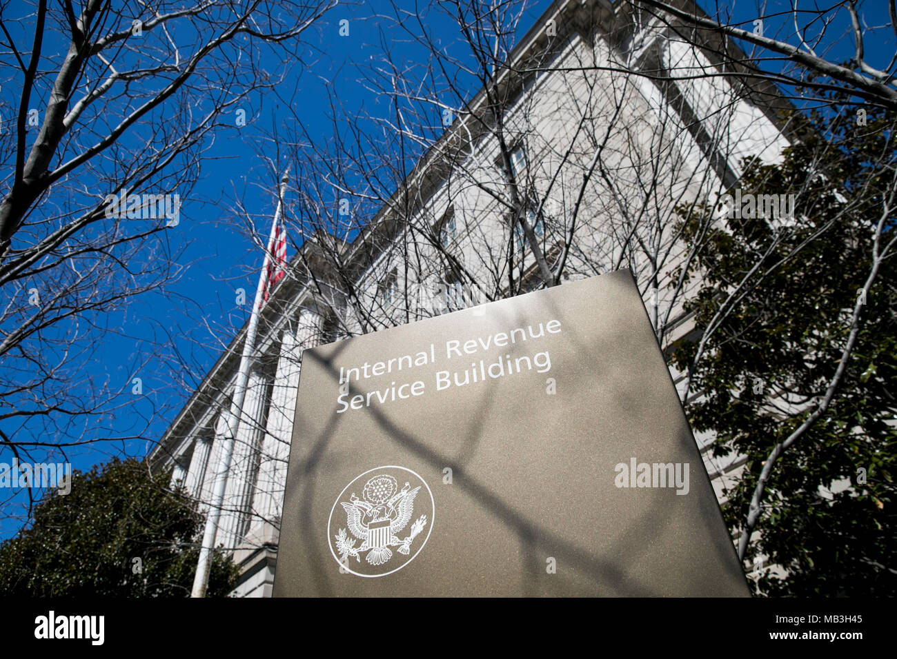 A logo sign outside of the headquarters of the Internal Revenue Service (IRS) in downtown Washington, D.C., on March 31, 2018. Stock Photo