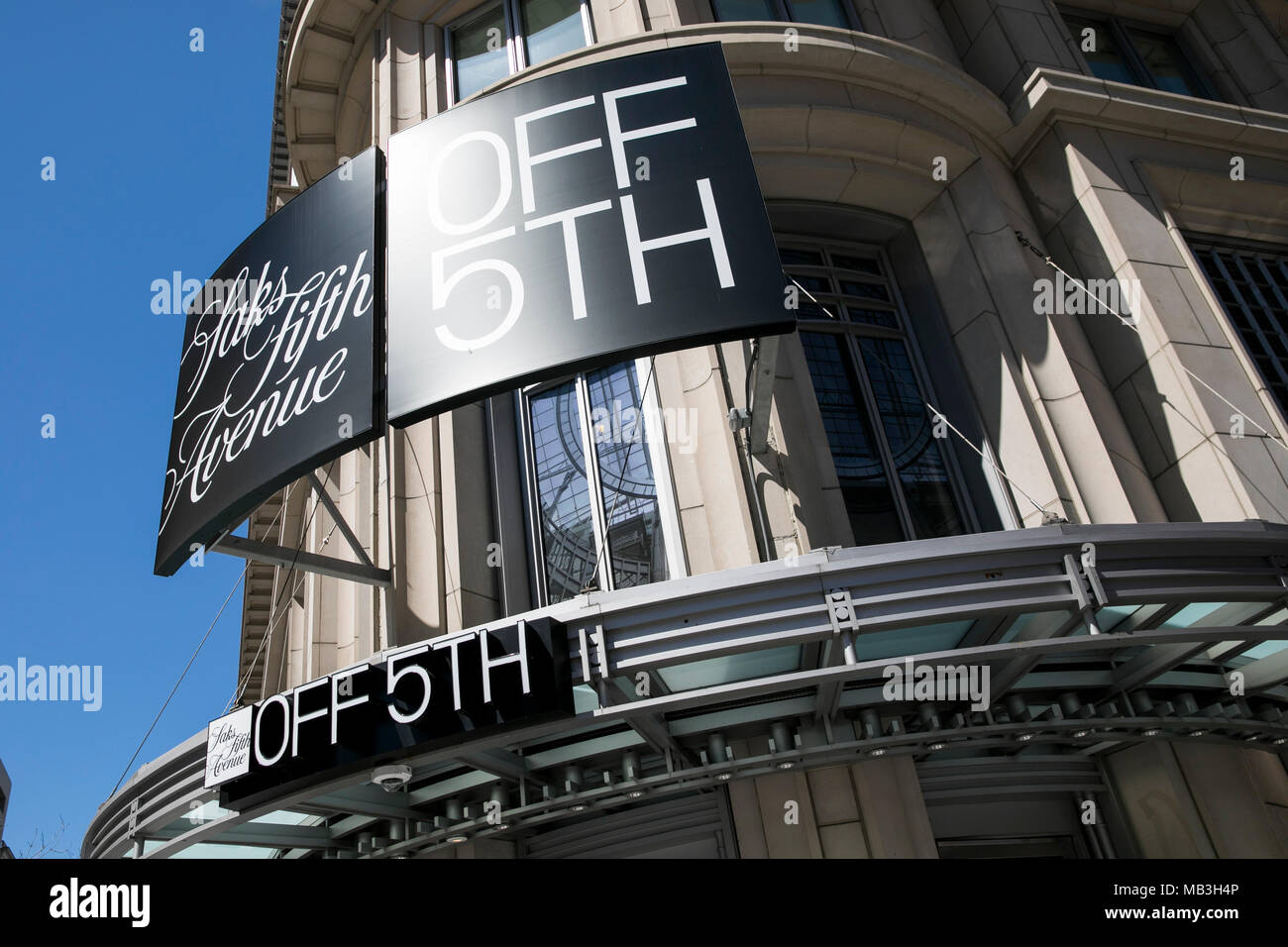 A logo sign outside of a Saks Fifth Avenue Off 5th retail store in downtown Washington, D.C., on March 31, 2018. Stock Photo