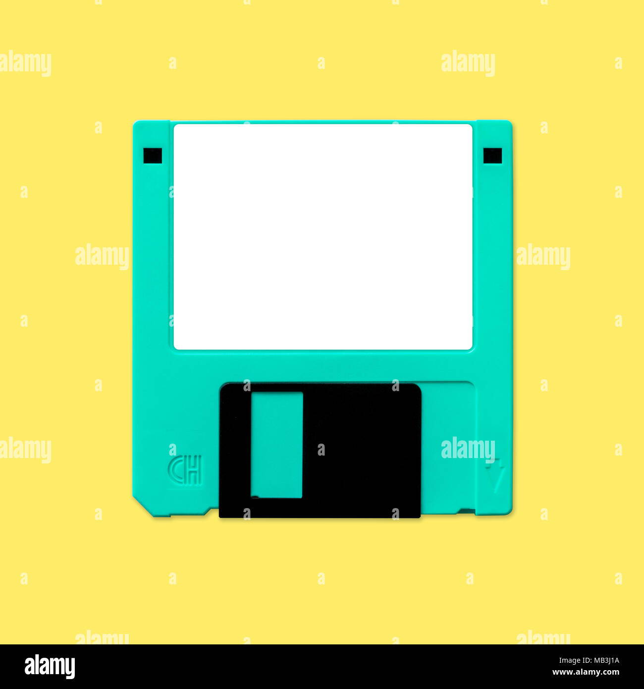 Obsolete 3.5 inch computer diskette, isolated and presented in punchy pastel colors with a blank white customizable label. Theme of early digital stor Stock Photo