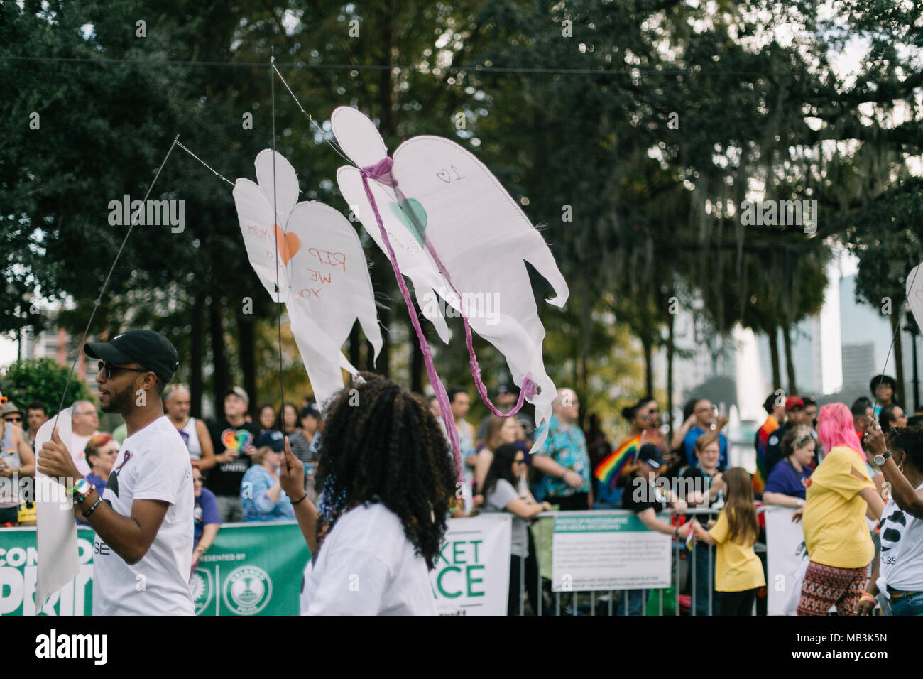 Pulse supporters march in Orlando Pride Parade with angels to remember and honor each of the victims in the Pulse shooting (2016). Stock Photo