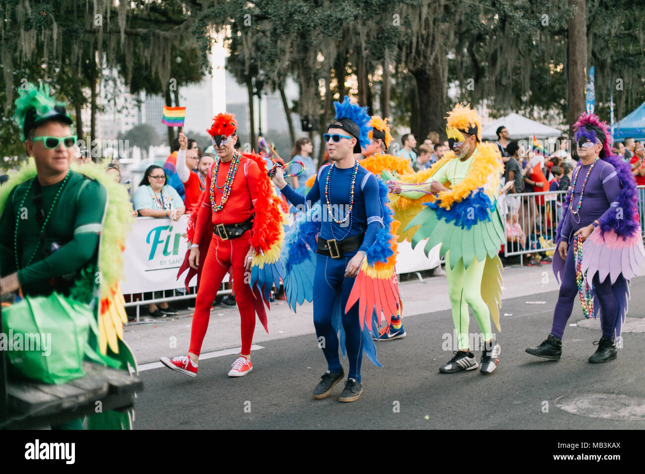 People dressed as colorful birds at the Orlando Pride Parade (2016). Stock Photo