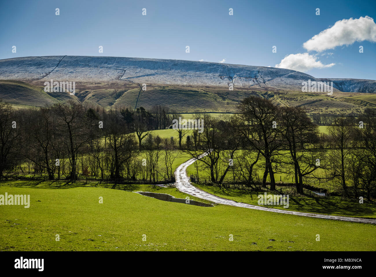 A farm track in the shadow of Pendle Hill, Lancashire, UK. Stock Photo