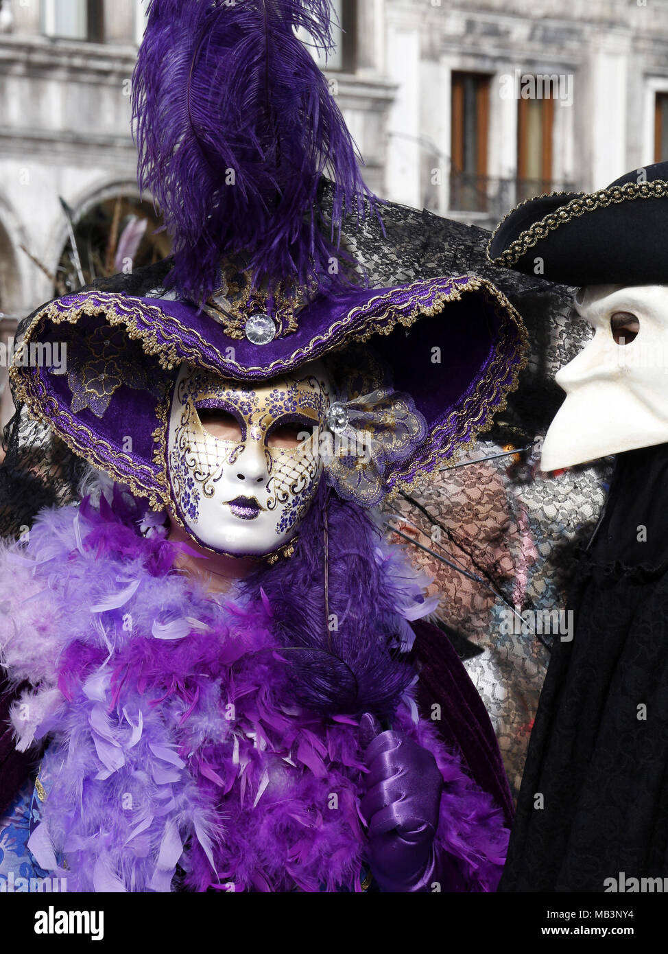 Woman and man in masks, Carnival at St Marks Square, Venice, Italy Stock Photo