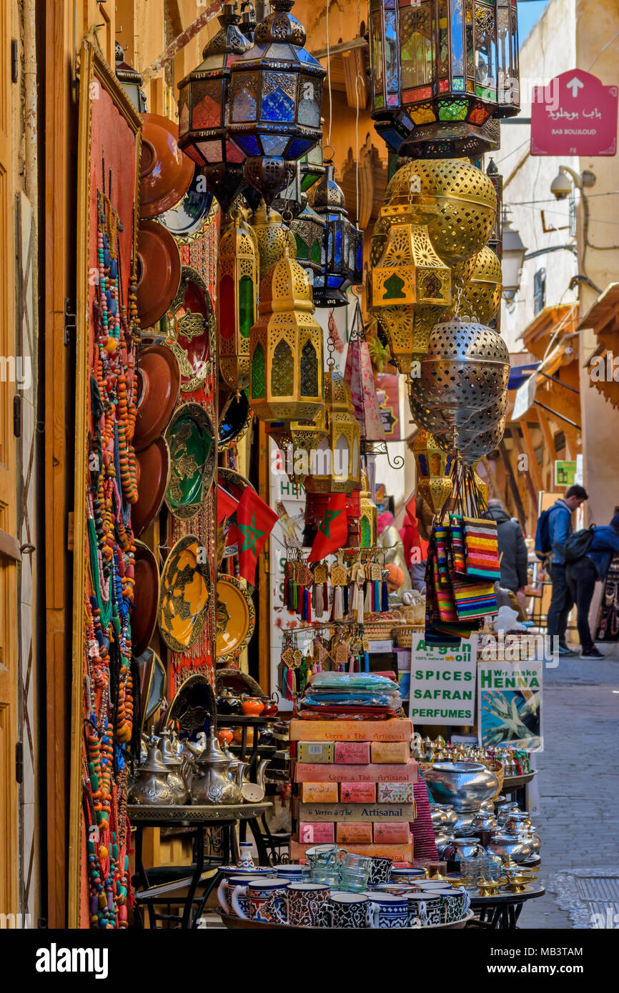 MOROCCO FES MEDINA SOUK INSIDE THE MEDINA COLOURFUL DISPLAY OF GOODS FOR SALE LAMPS DISHES KEY RINGS NECKLACES Stock Photo