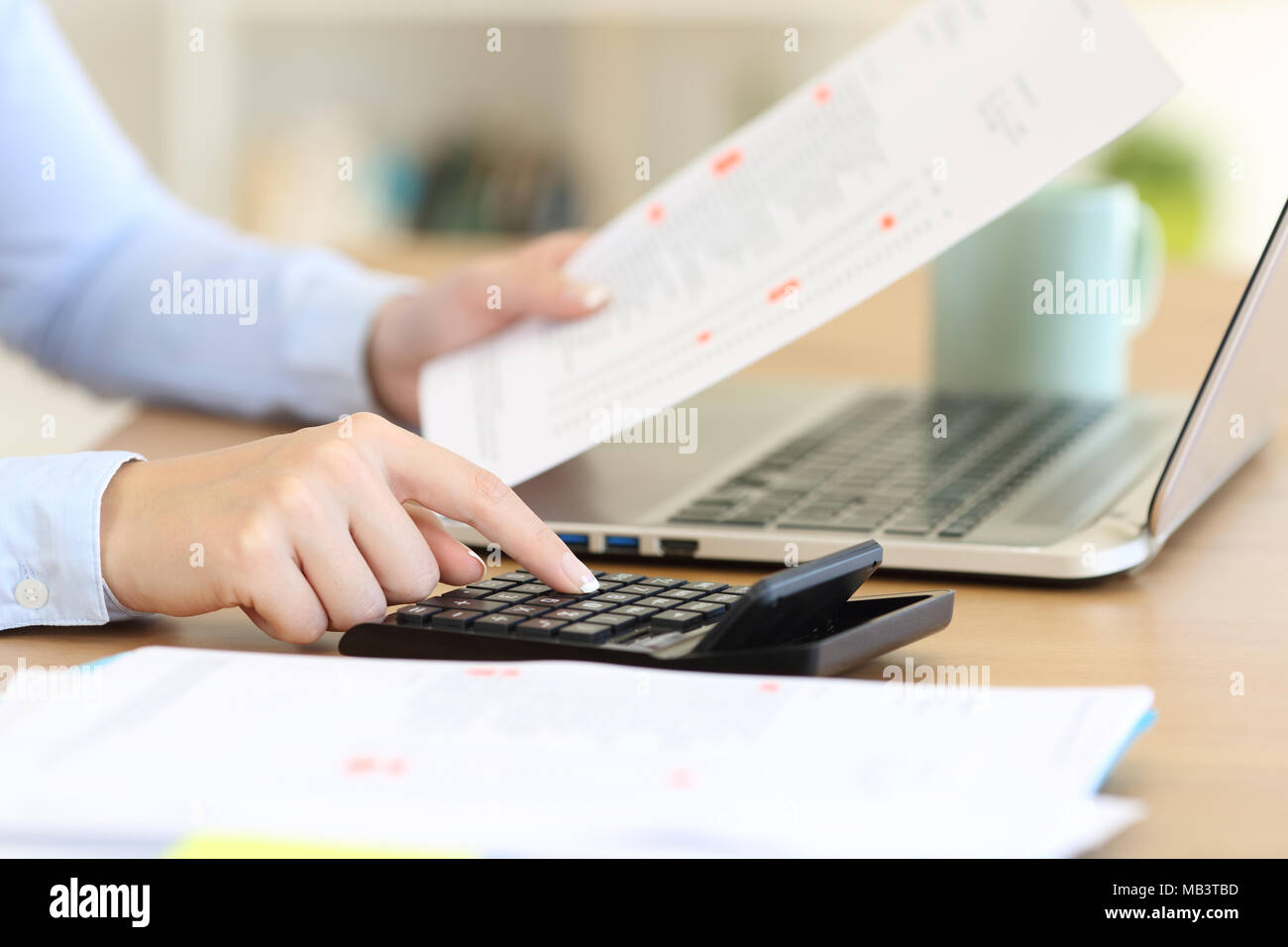 Close up of an accountant hands calculating with a calculator on a desk Stock Photo