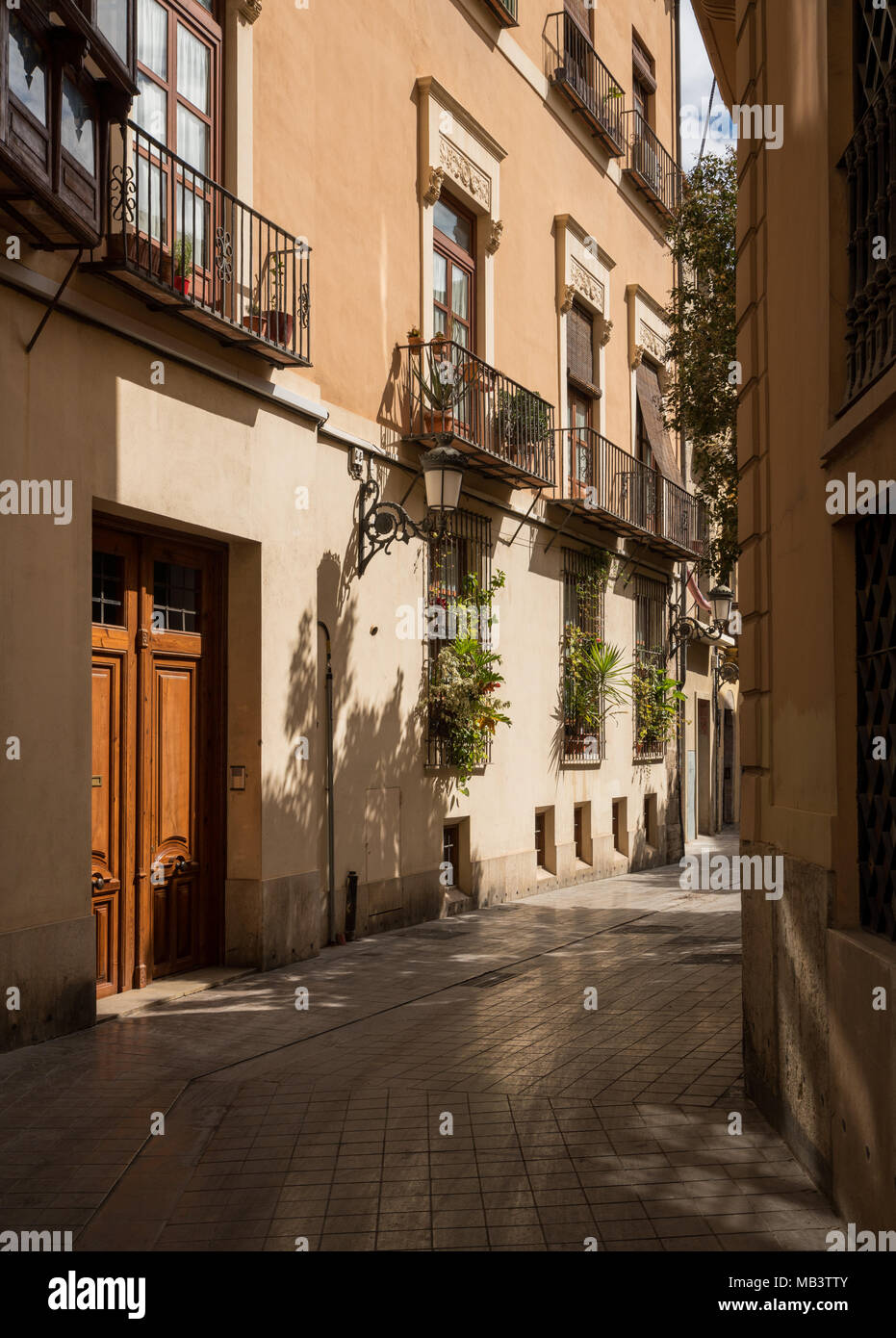 Narrow peaceful street in old town of Valencia Spain Stock Photo