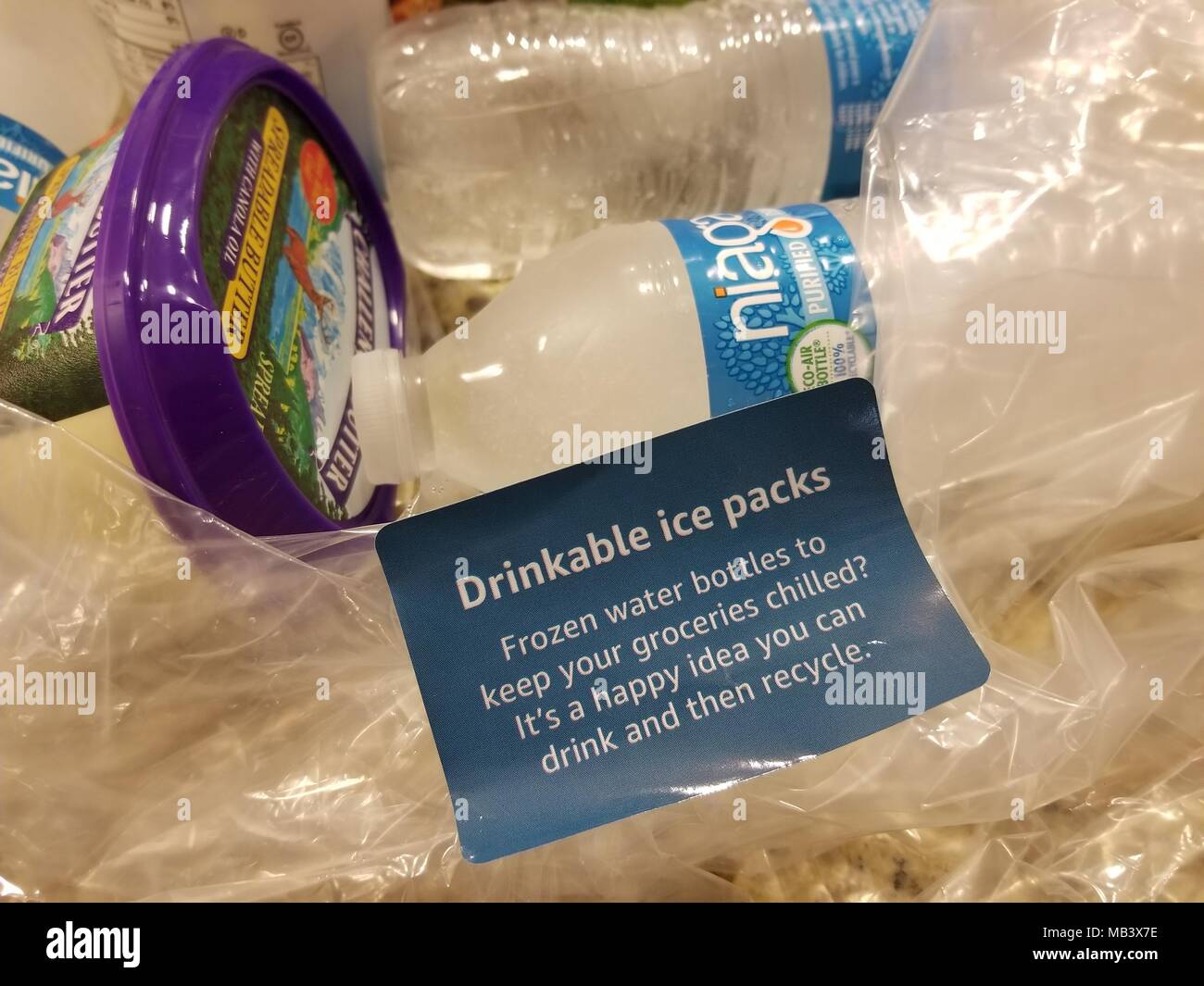 Amazon Fresh grocery delivery order packed with frozen bottled water in  place of disposable ice packs, as part of new sustainability initiatives  from Amazon.com, San Ramon, California, March 28, 2018 Stock Photo -