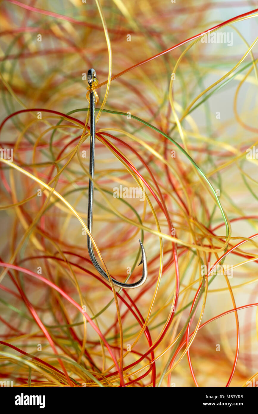 very tangled fishing line, hook in the foreground, all on white background  Stock Photo - Alamy