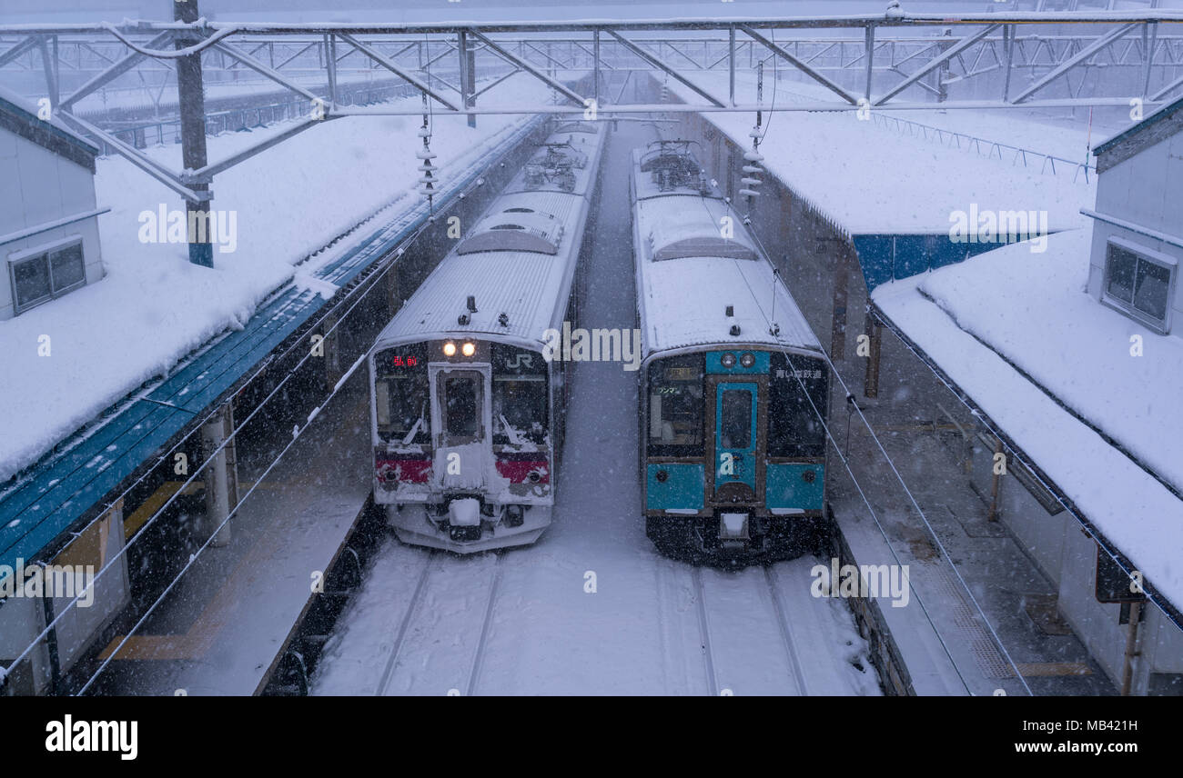 Japan Rail (JR East) and Aoimori Line trains in snow at Aomori Station