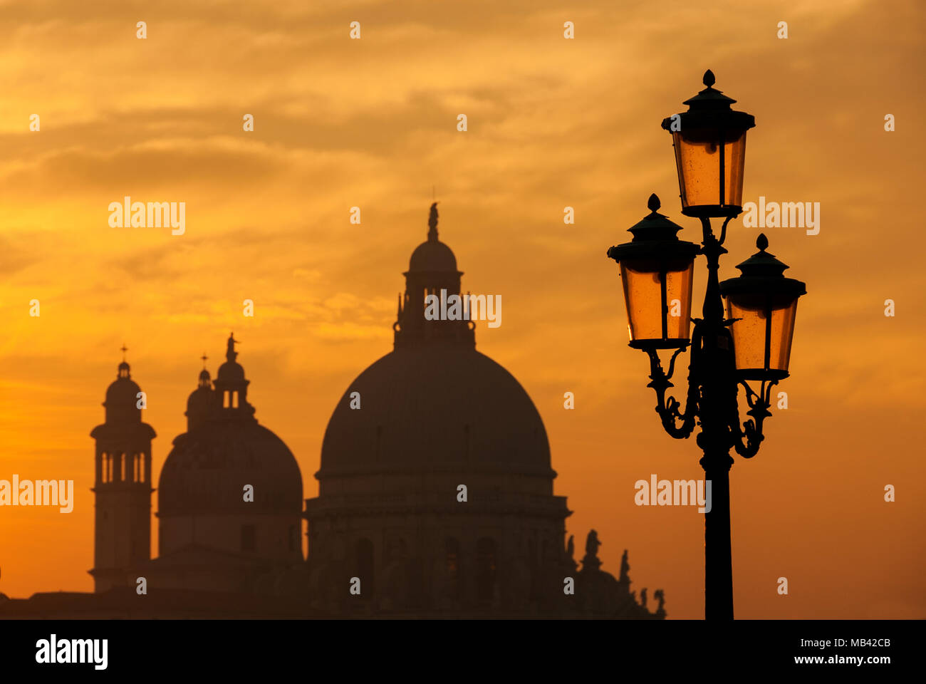 Old traditional Venice street lamps at sunset with Salute Basilica old ...
