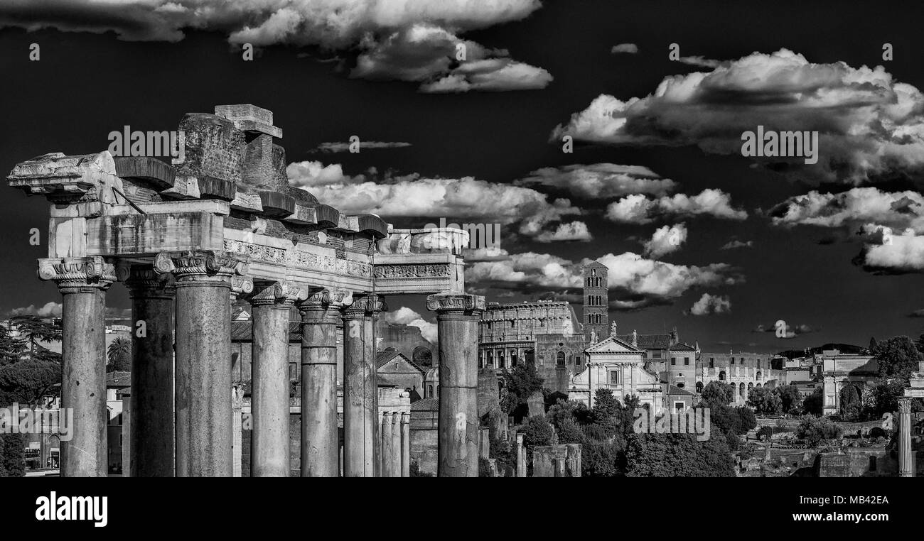 View of the Roman Forum ancient monuments and Coliseum from Capitoline Hill in Rome (Black and White) Stock Photo
