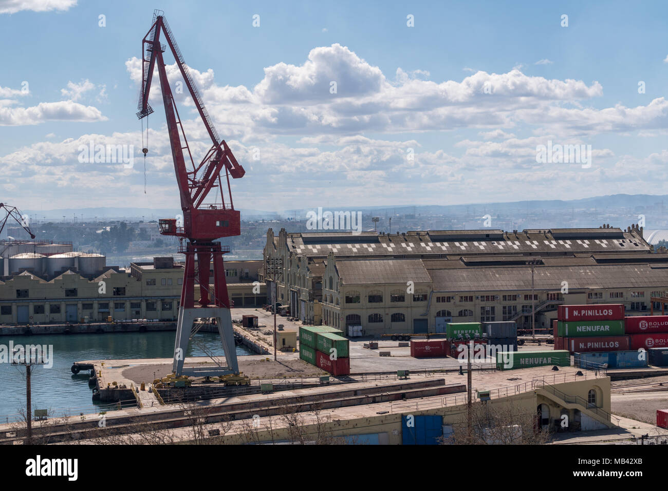 Older crane on dockside in Valencia harbor Stock Photo
