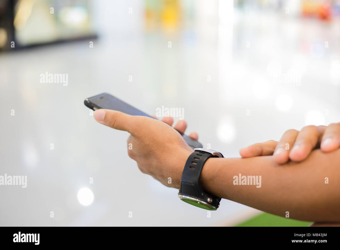 man asian using phone for celling and texting on her mobile phone Stock Photo